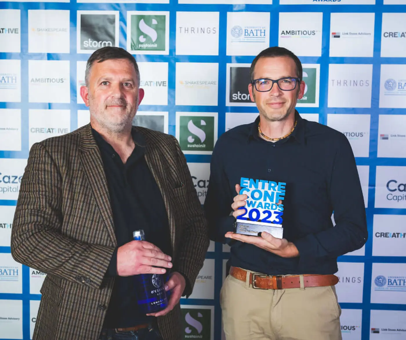 Team holding EntreConf 2023 award for Employer