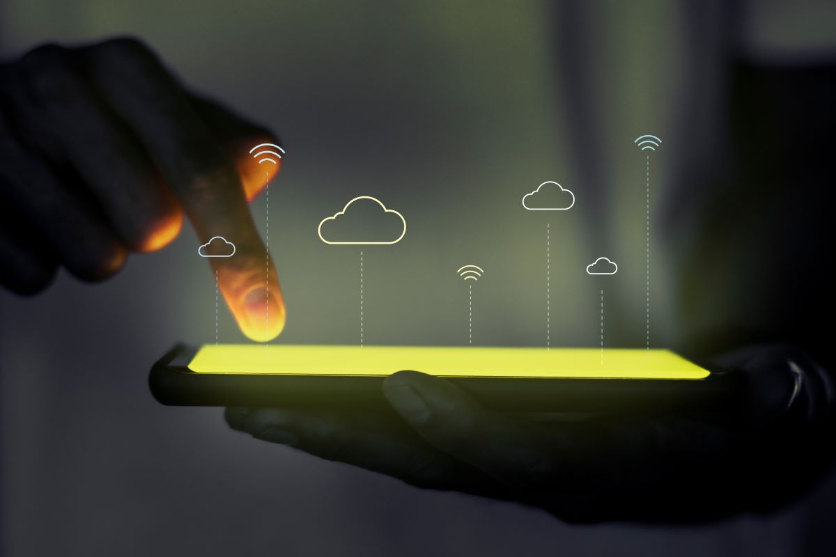 Glowing screen with cloud icons above