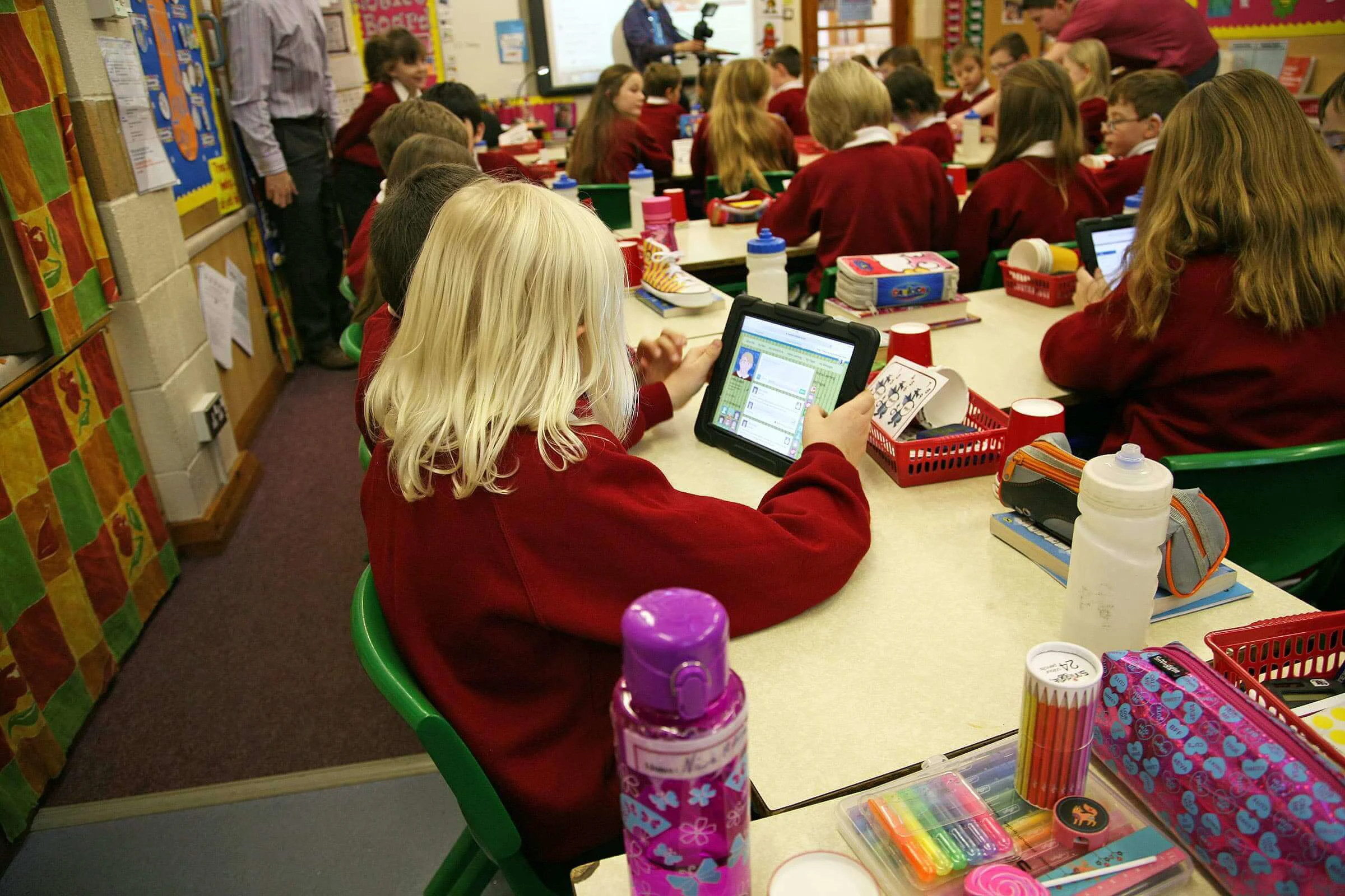 School children using Blue turtle VLE on tablets