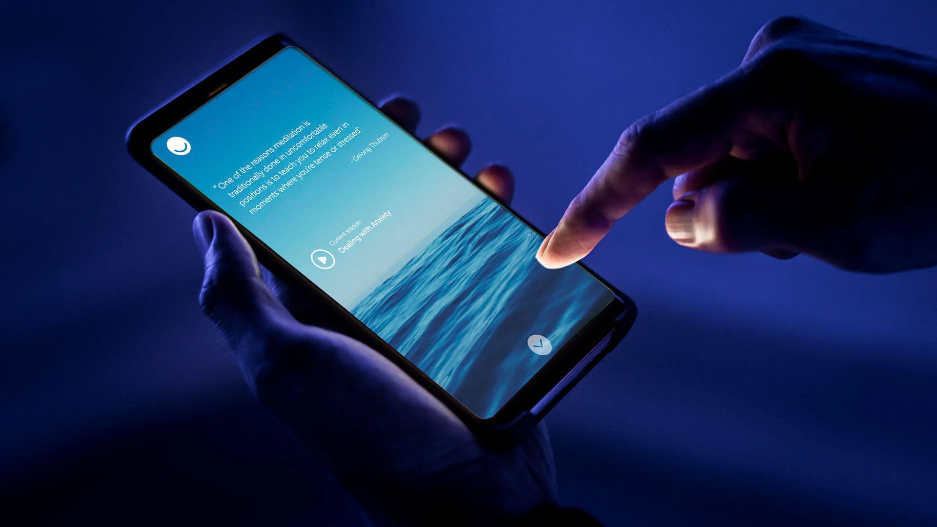 Person holding a phone with the Samten app on Person holding a phone with the Samten app on