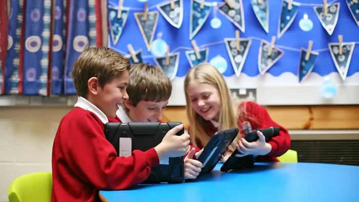 School children using Blue turtle VLE on tablets