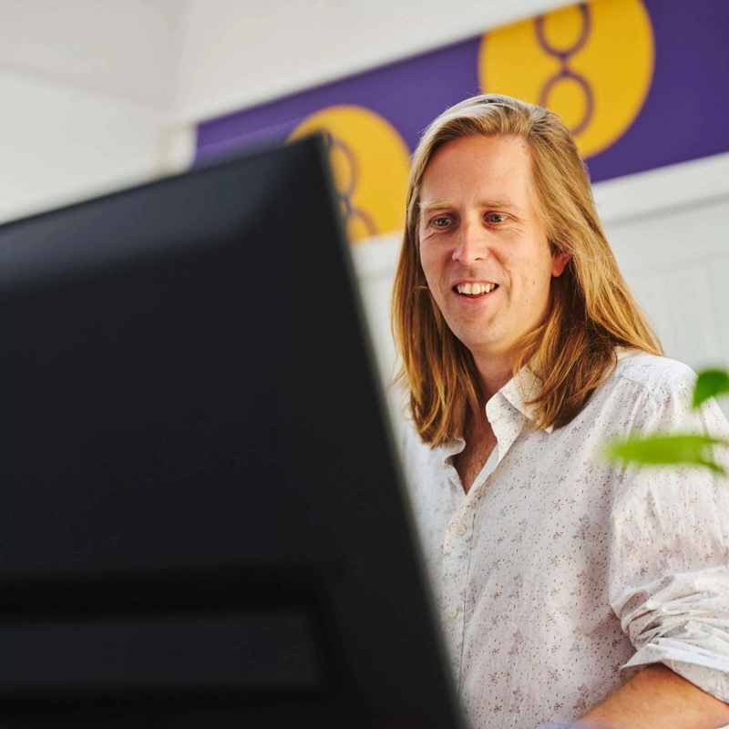 Darren McGrath looking at computer screen