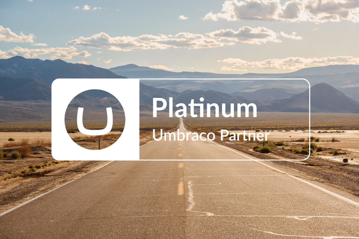 Image of road in the desert going into the distance with Umbraco Platinum Partner logo  