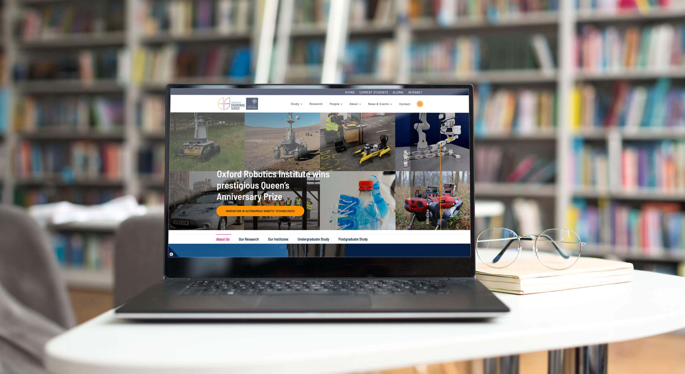 Oxford University website on laptop in library 
