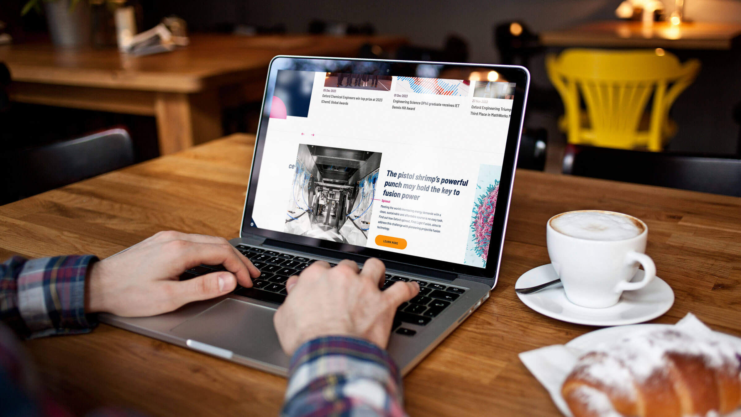 Oxford University website on laptop in cafe