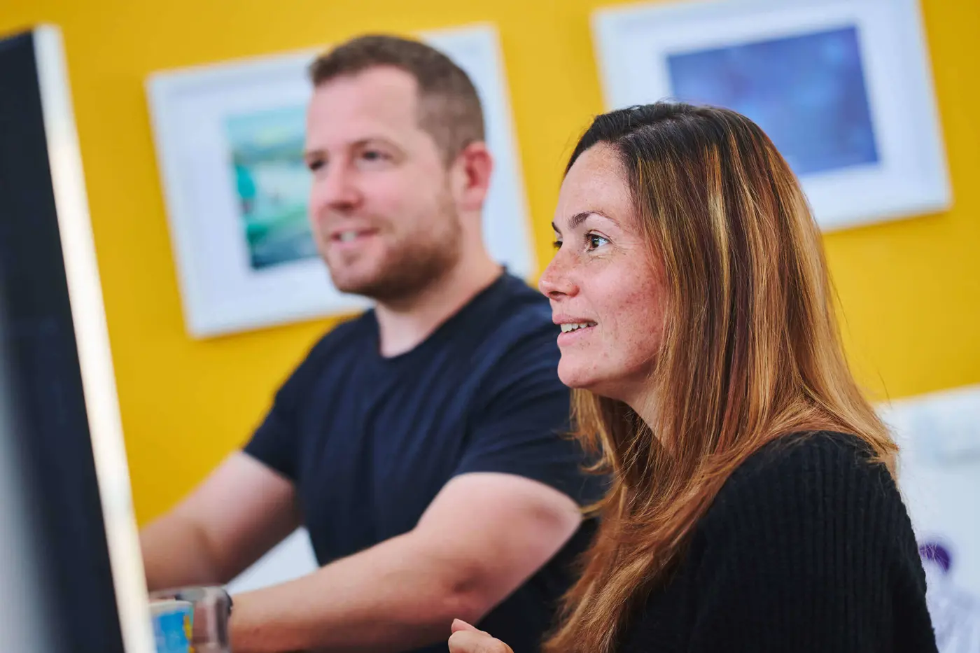 Kevin Triggle and Laura Pinkstone looking at a computer screen