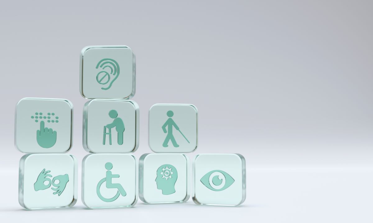 Square glass cubes with symbols for different types of disabilities impacted by accessibility.